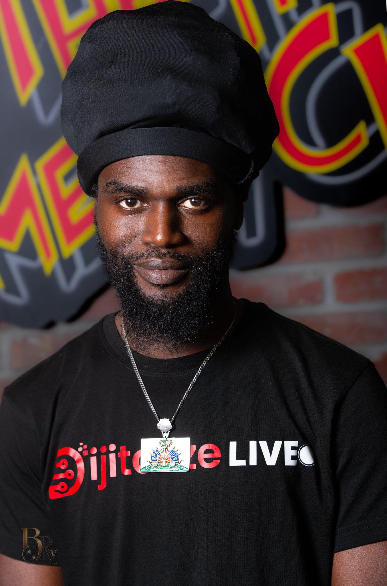 Comedian portrait with direct eye contact and brick wall background by Big Rich Visuals
